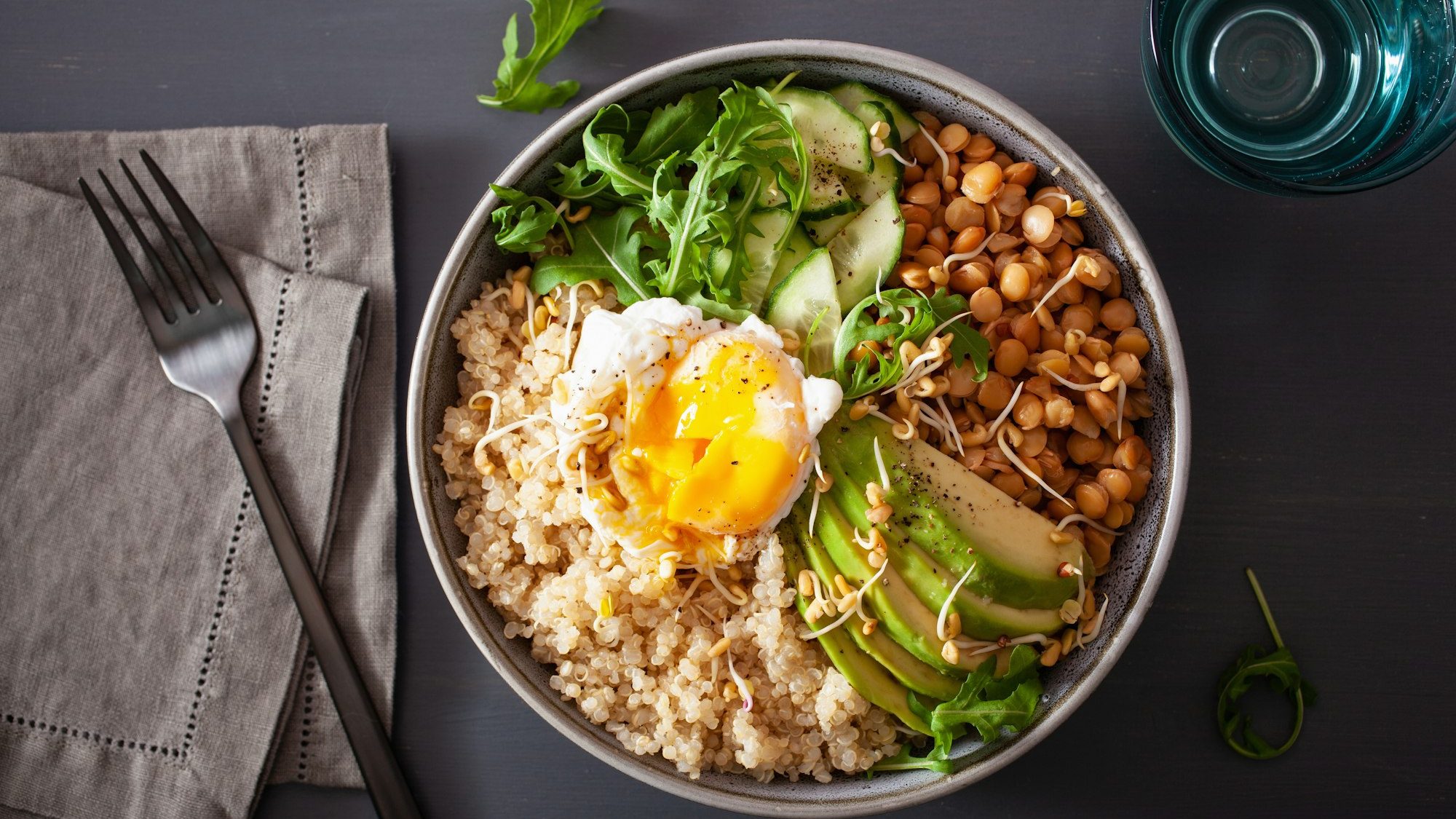 quinoa bowl with egg, avocado, cucumber, lentil. Healthy vegetar