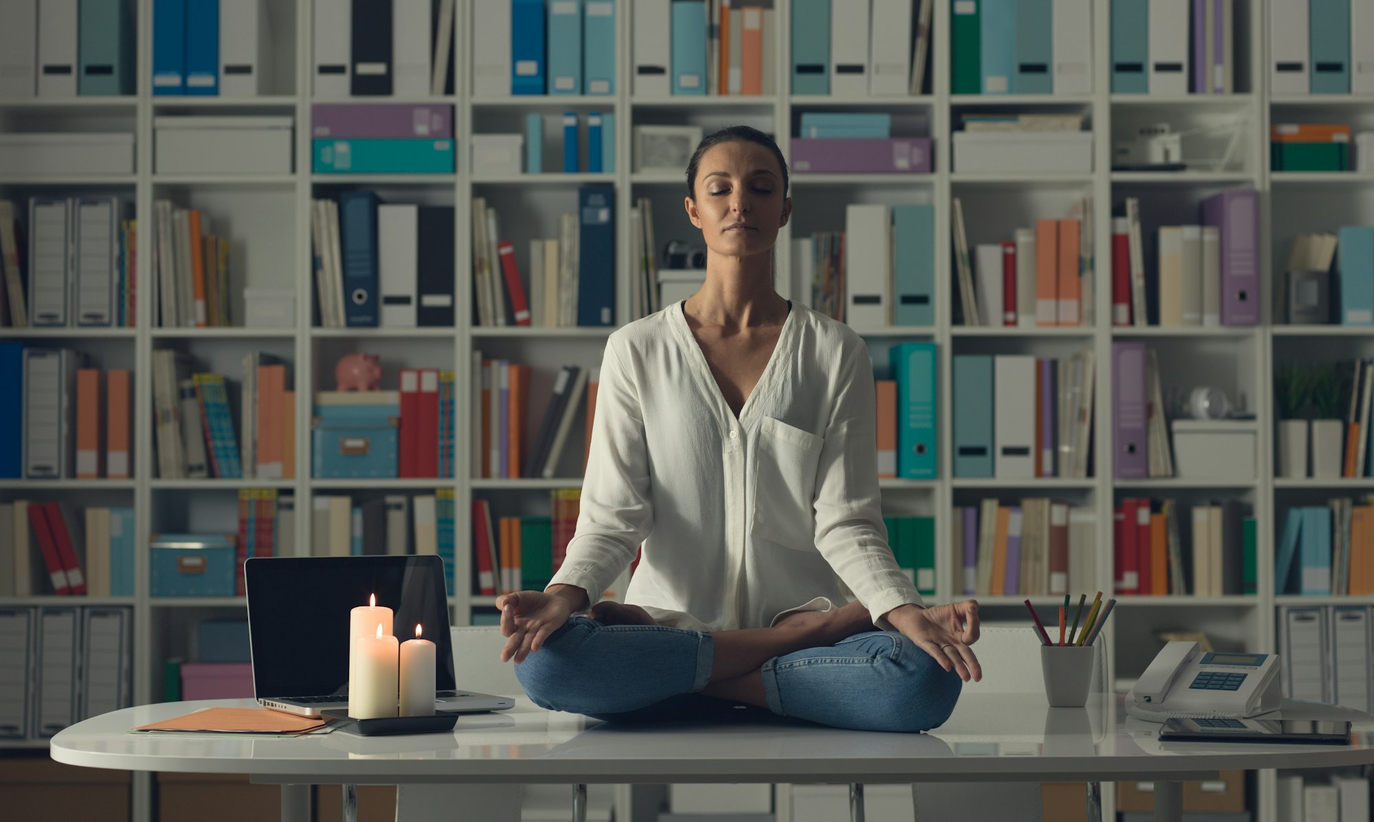 Woman practicing meditation at home